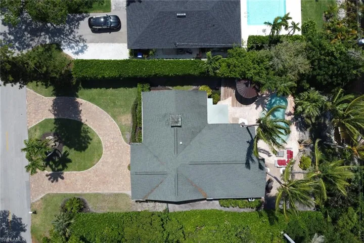 View of subject property with a pool
