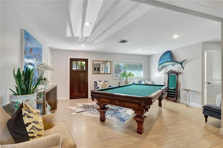 Recreation room with billiards table, healthy amount of natural light, baseboards, light wood-type flooring, and recessed lighting