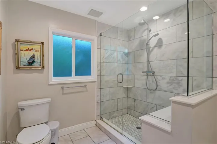 Main bathroom featuring  a stall shower
