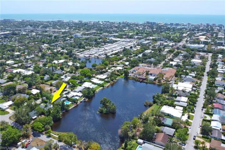 View of property location featuring a large body of water and nearby urban area