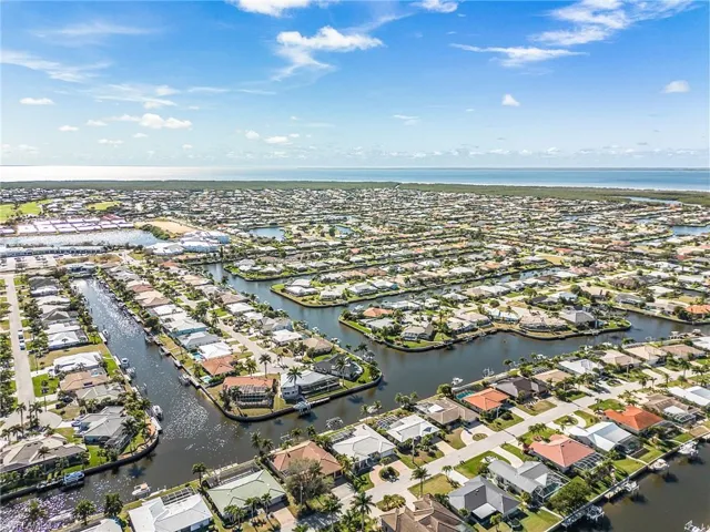 Aerial perspective of suburban area with a large body of water