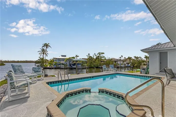Pool and Spill-over spa overlooking intersecting canal.