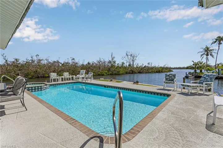 Pool with views of intersecting canal and back bay.