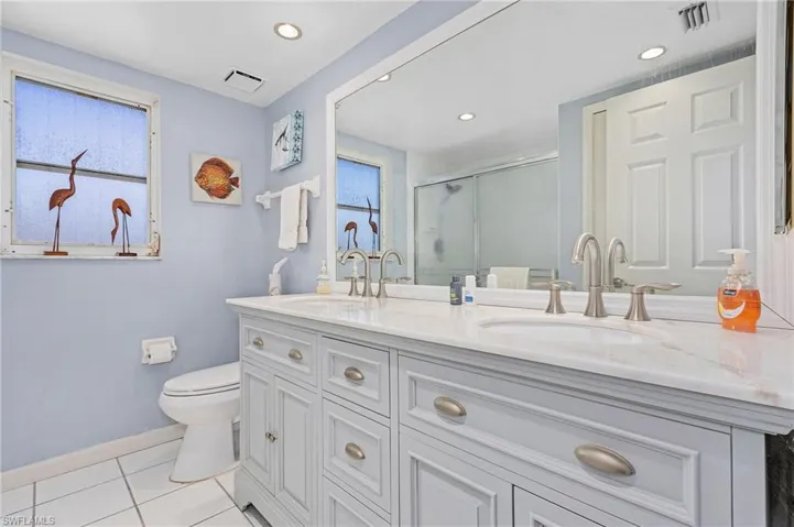 Updated guest bath with dual sinks.