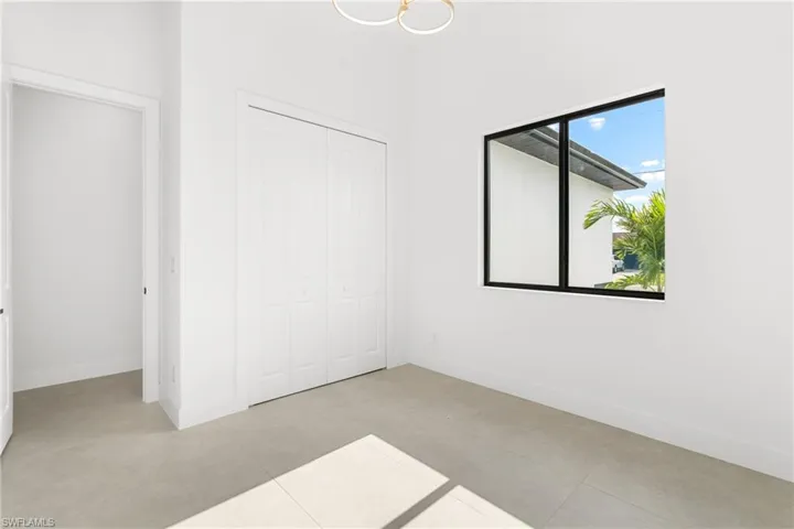Neutral interior with light-toned flooring and white walls