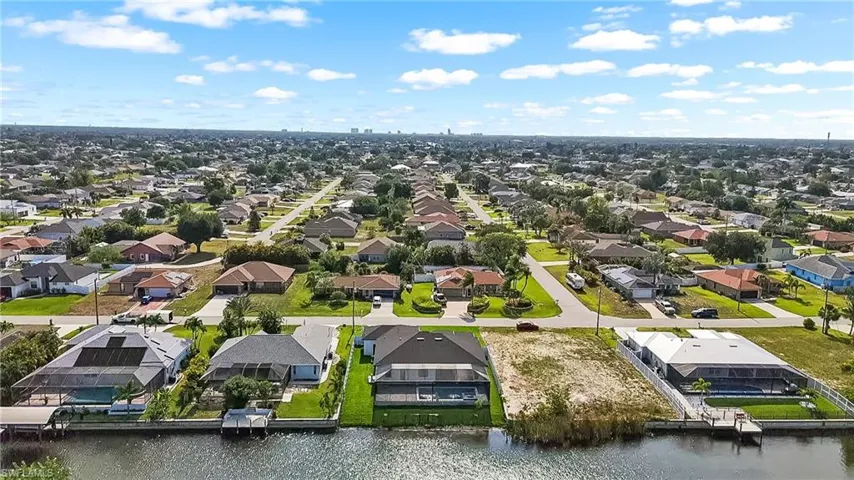 Waterfront lot featuring direct canal access, an undeveloped landscape, and potential for a private dock