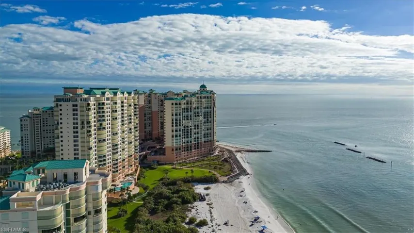 Bird's eye view with a water view and a view of the beach