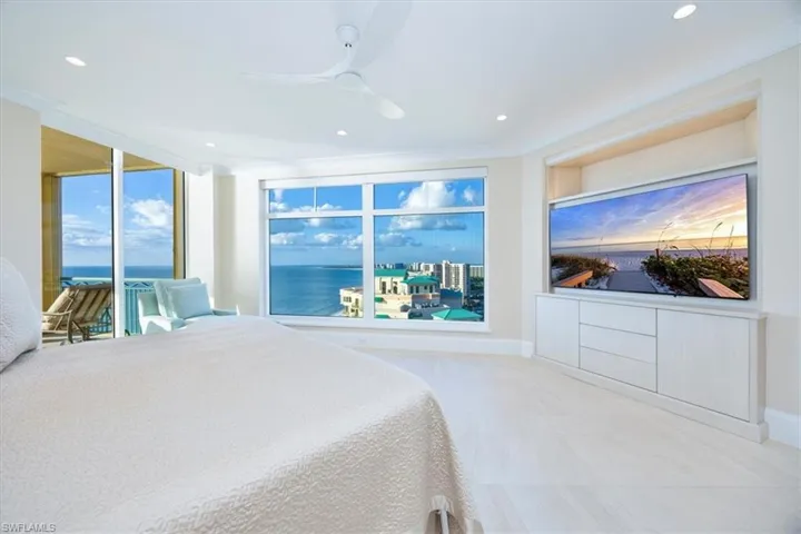 Bedroom featuring ceiling fan and ornamental molding