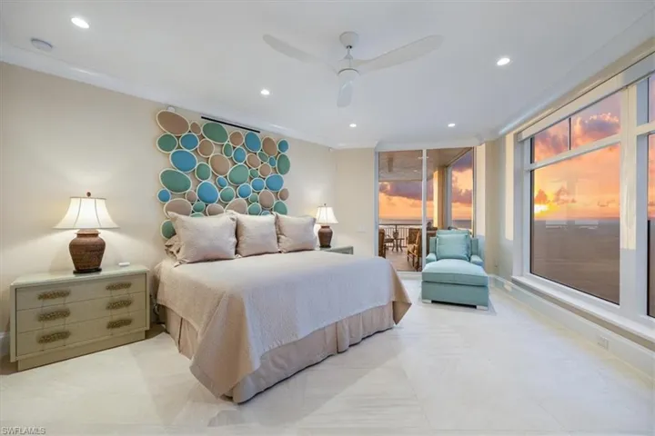 Bedroom with ceiling fan and crown molding