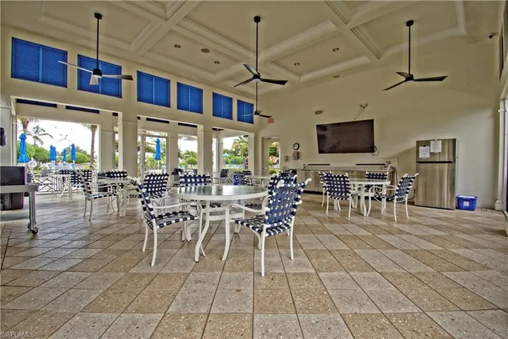 Spacious open-air pavilion featuring patterned tile flooring and a coffered ceiling
