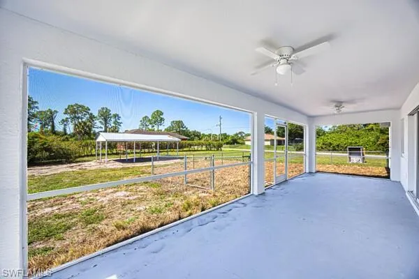 Large lanai featuring ceiling fan
