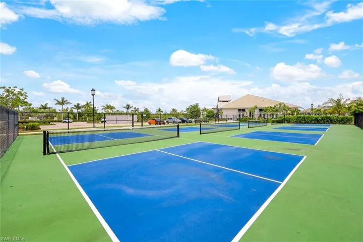 View of tennis court with fence