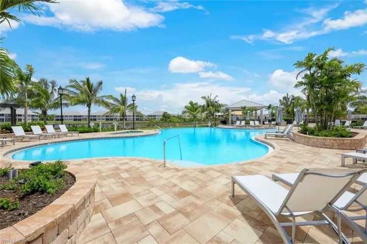 Pool featuring fence and a patio area