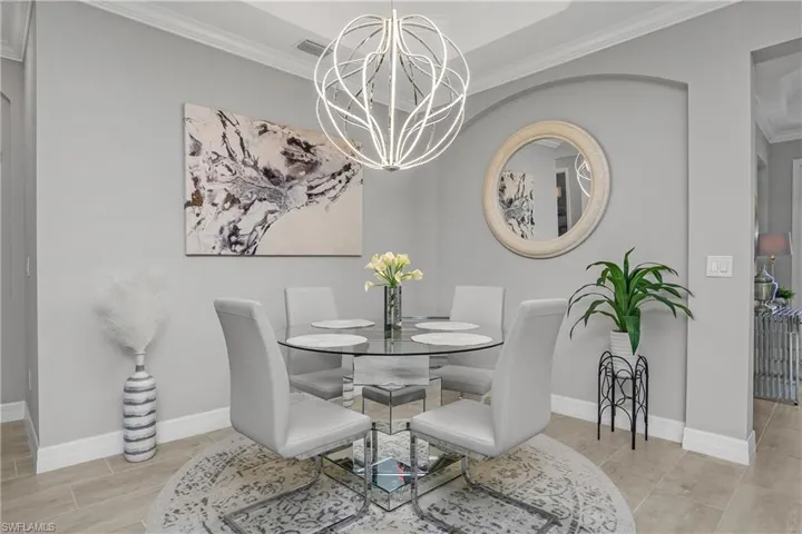 Tray ceiling with crown molding, custom chandelier, and all furnishings and decor INCLUDED.