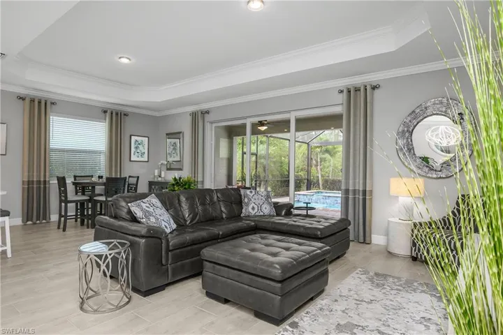 Impact sliders just off the great room create a seamless indoor/outdoor living experience.