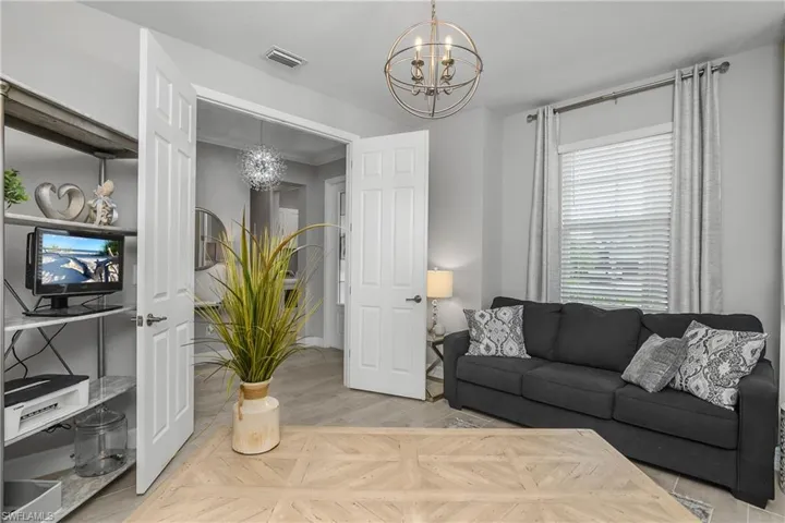 Den features double entry French door, sleeper sofa, and is the perfect work-from-home office space.