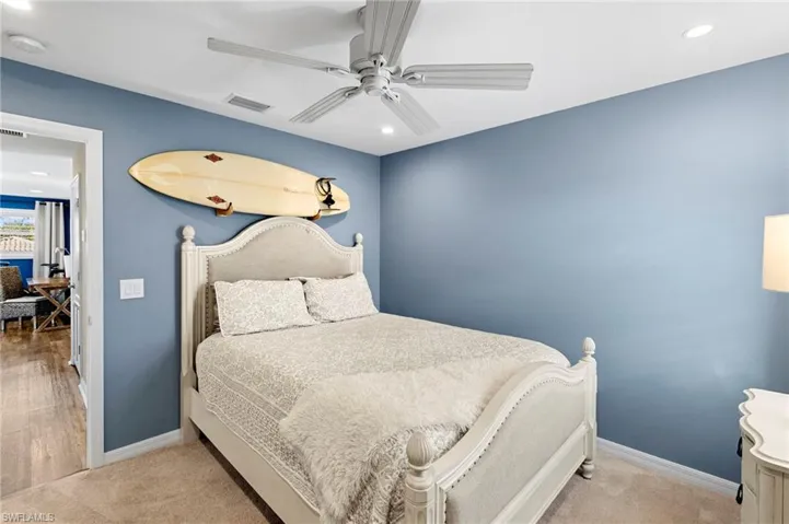 Bedroom featuring recessed lighting, a ceiling fan, and light colored carpet