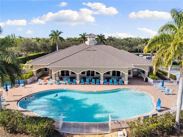 Community pool with a patio area