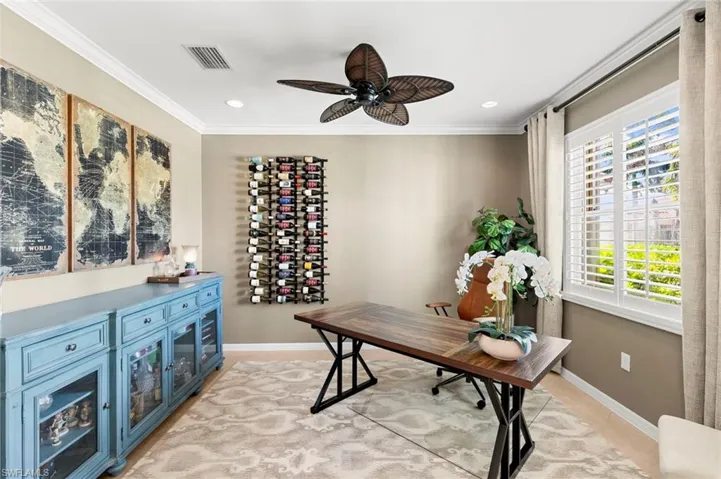 Home office featuring ornamental molding, ceiling fan and recessed lighting