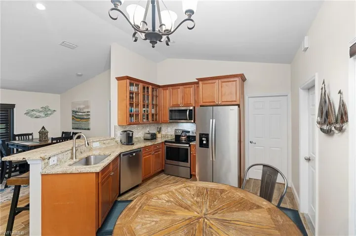 Open Kitchen with Granite Countertops & Stainless Steel Appliances