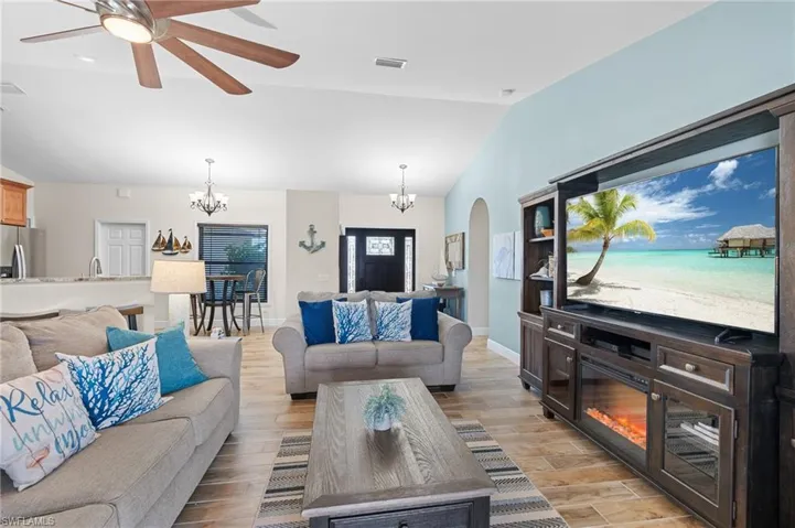 Living Area with Vaulted Ceiling & Tile Floors Throughout