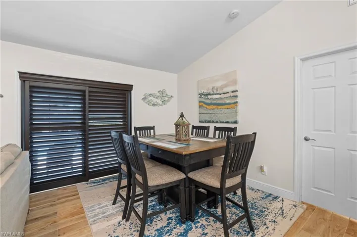 Dining Area has Slider with Plantation Shutters to the Lanai