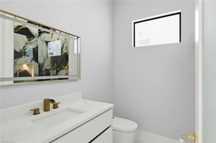 Bathroom with vanity and toilet
