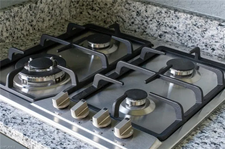 Kitchen view of stainless steel gas stovetop