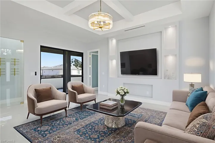 Living area with coffered ceiling and beam ceiling