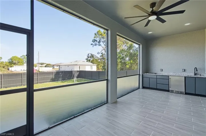 Unfurnished sunroom with a sink