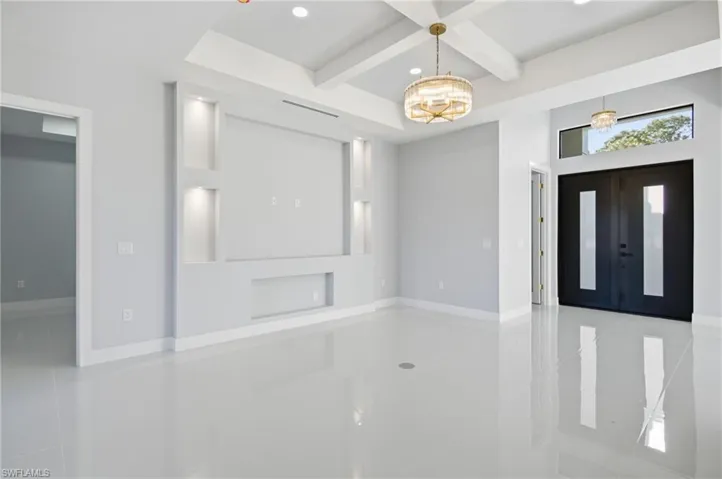 Entrance foyer with coffered ceiling, beam ceiling, and recessed lighting