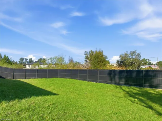 View of fenced backyard