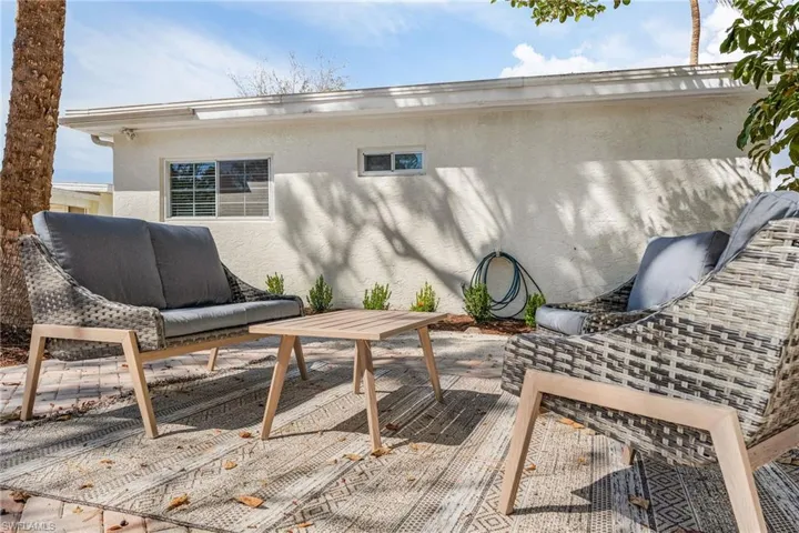 Wooden terrace featuring a patio and outdoor furniture