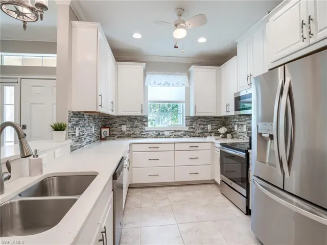 Stainless Steel Appliances and U shaped kitchen