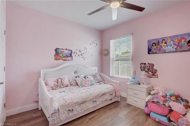Bedroom featuring wood finished floors and a ceiling fan