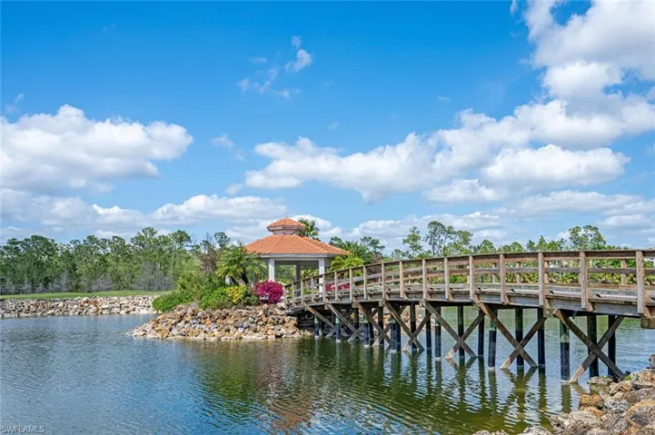 View of dock featuring a gazebo and a water view