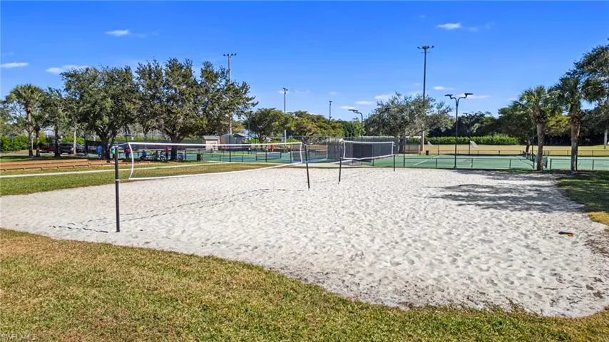 View of community with volleyball court and a tennis court