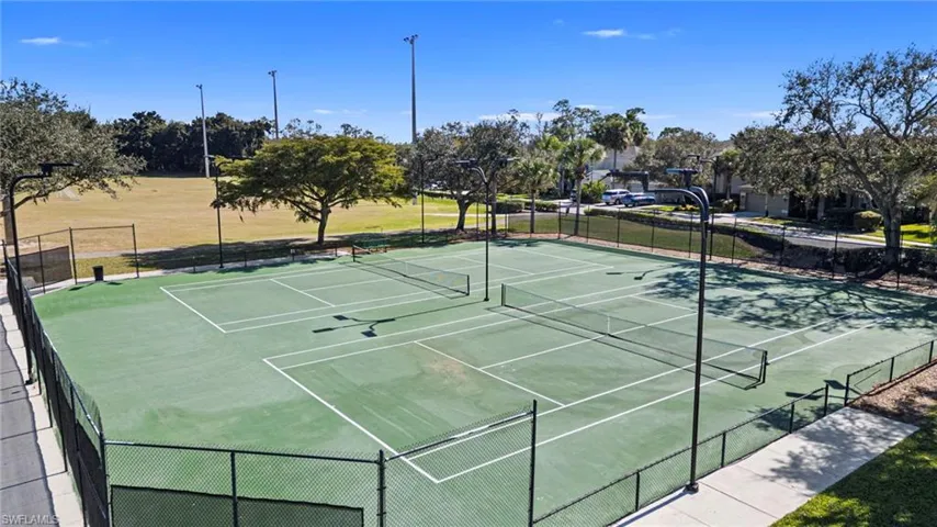 View of tennis court with community basketball court