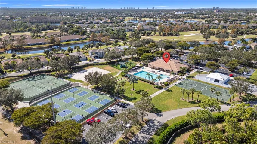 Aerial view of property's location featuring nearby suburban area and a large body of water