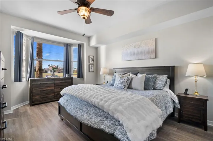 Bedroom featuring wood finished floors and ceiling fan