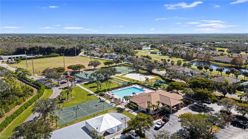 Aerial view of property's location featuring nearby suburban area and a large body of water