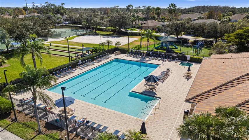 Community pool featuring a patio area and a residential view