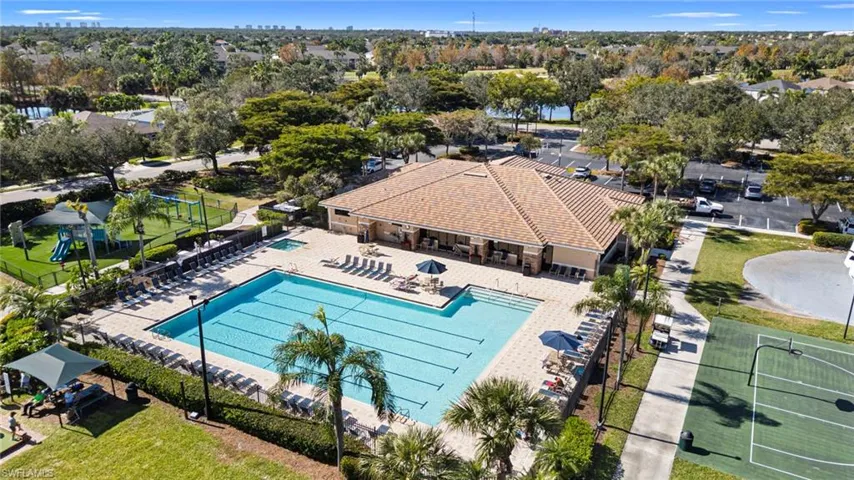 Community pool featuring a patio and a residential view