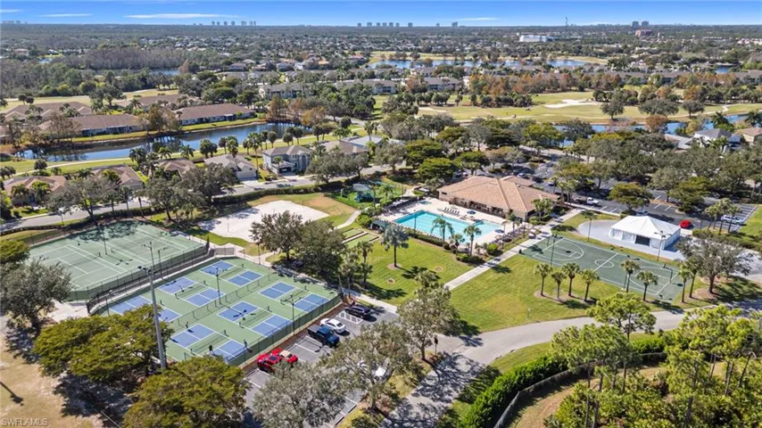 Aerial view of property's location with nearby suburban area and a nearby body of water