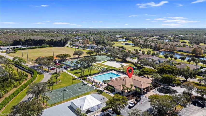 Aerial view of property's location with nearby suburban area and a large body of water