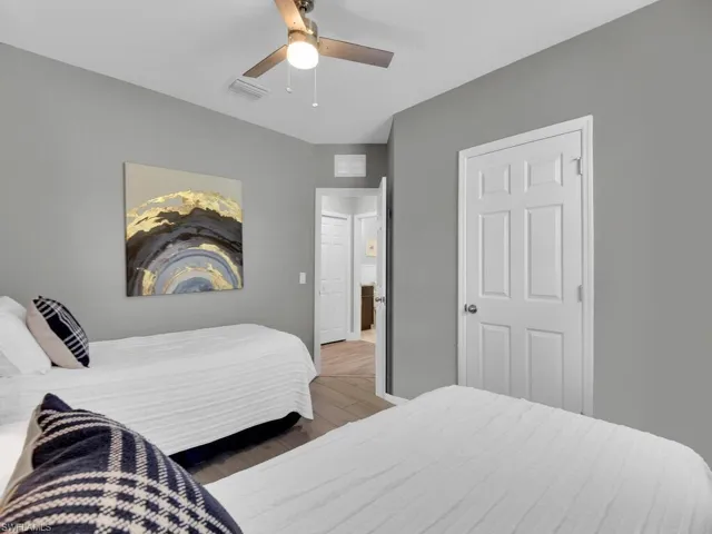 Bedroom with light wood-style flooring and ceiling fan