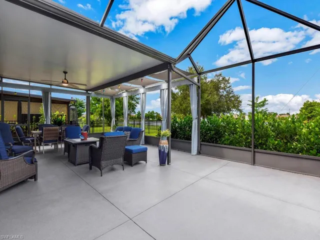 View of patio with a sunroom, a lanai, and an outdoor hangout area