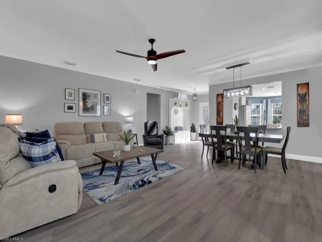Living area featuring ceiling fan and wood finished floors