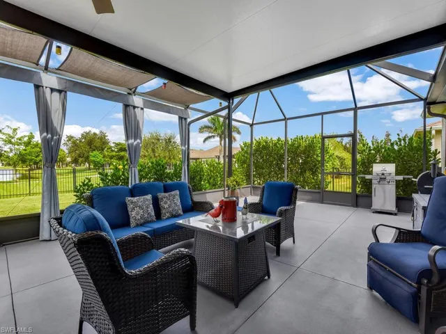View of patio featuring an outdoor hangout area, a lanai, a sunroom, and a grill