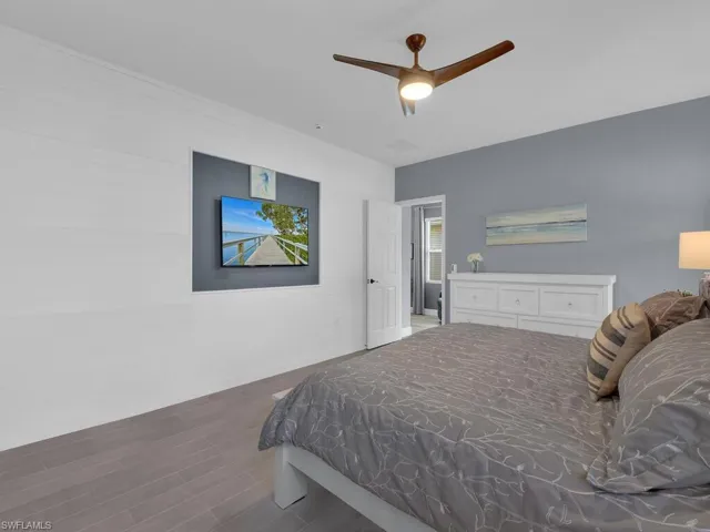 Bedroom featuring a ceiling fan and wood finished floors